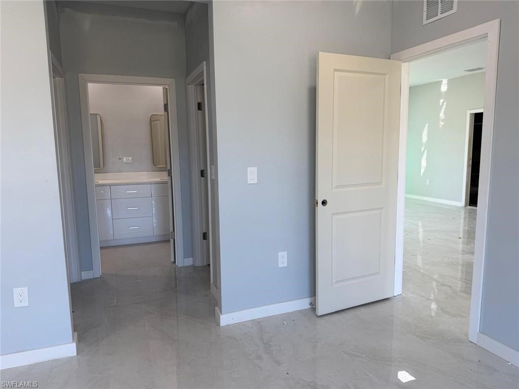 Unfurnished bedroom featuring baseboards