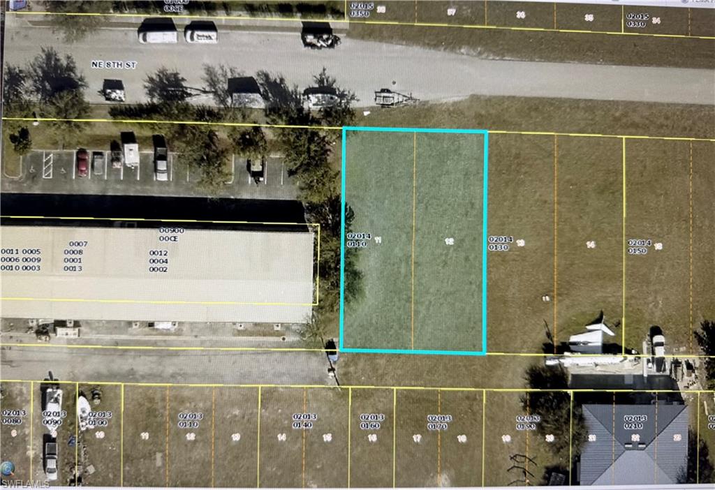 Aerial map of property and surrounding area with property parcel outlined