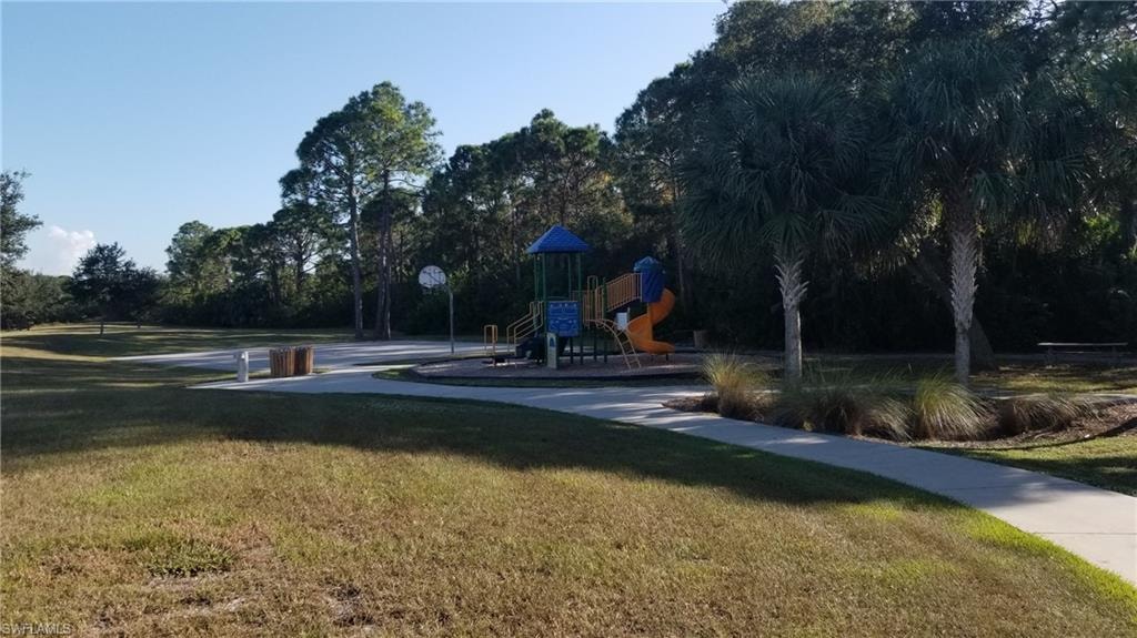 View of community with a playground and a lawn