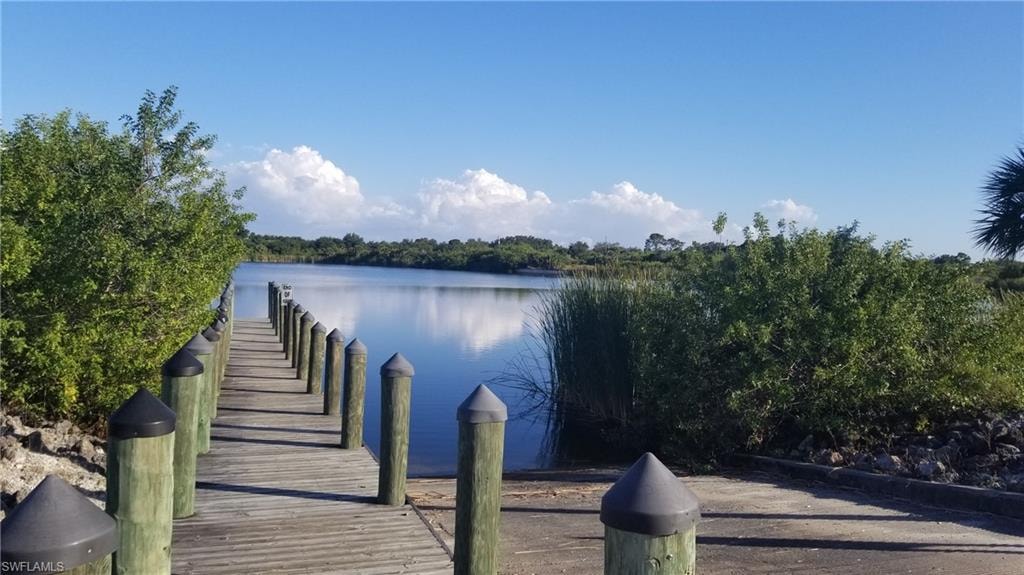Dock area featuring a water view