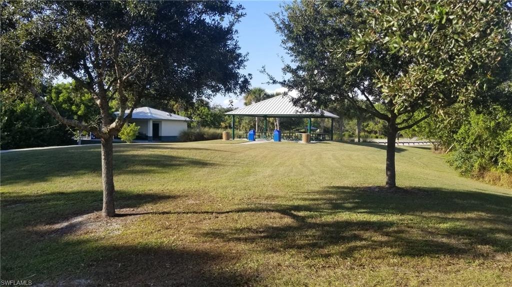 Surrounding community with a gazebo and a yard