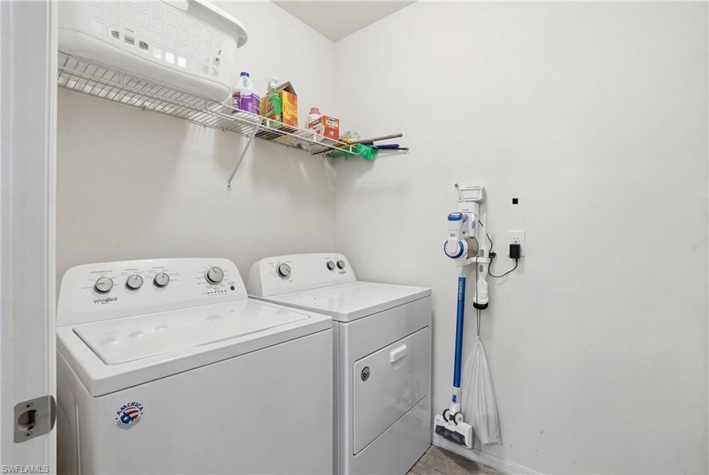 Laundry room featuring separate washer and dryer