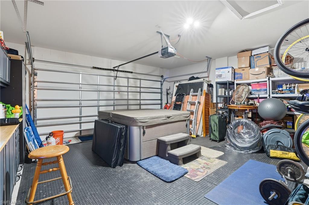 Garage featuring a garage door opener