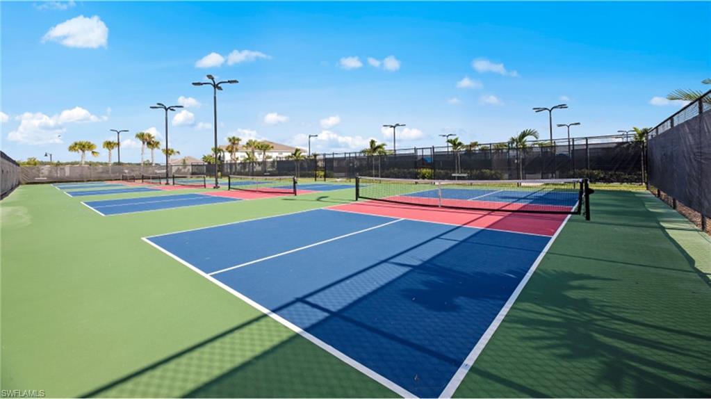 View of sport court featuring fence and community basketball court