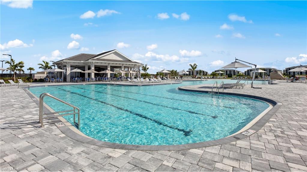 Community pool featuring a patio