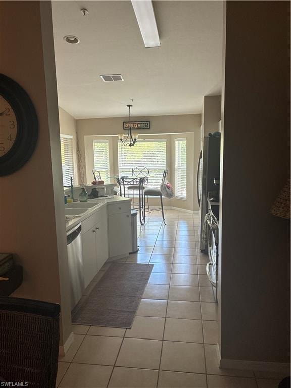 Kitchen area with neutral tile flooring