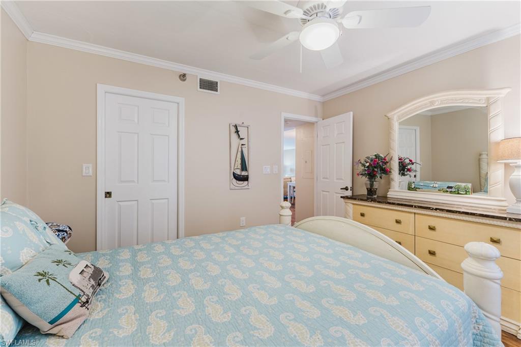 Bedroom with crown molding and ceiling fan