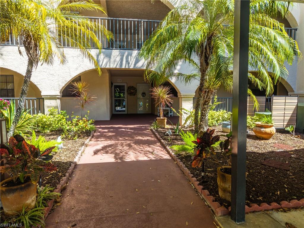 Entrance to property with stucco siding