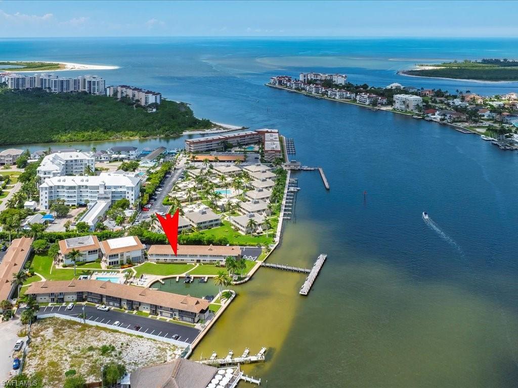 Aerial overview of property's location with nearby urban area and a large body of water
