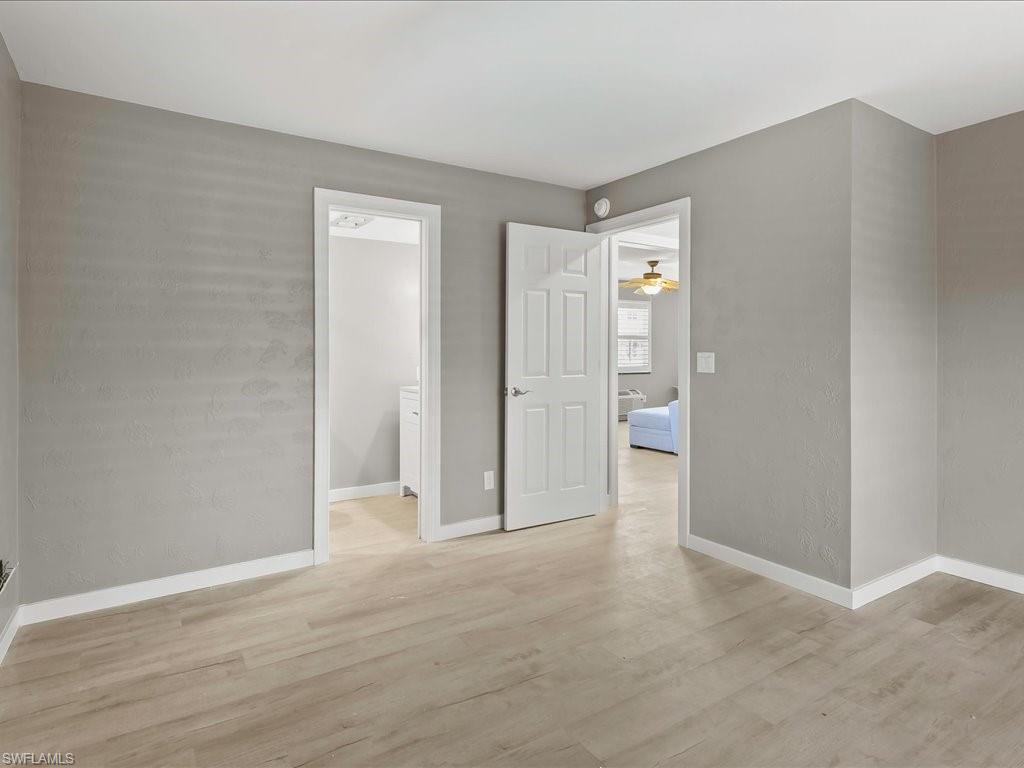 Spare room featuring light wood-style floors and ceiling fan