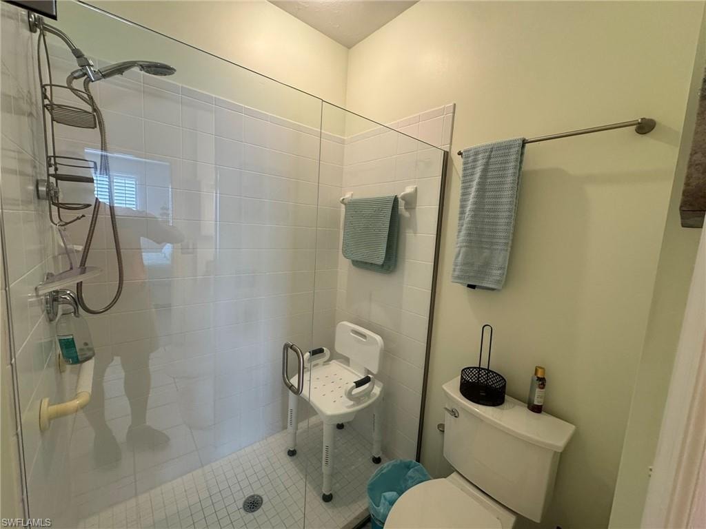 Bathroom with toilet and walk in shower
