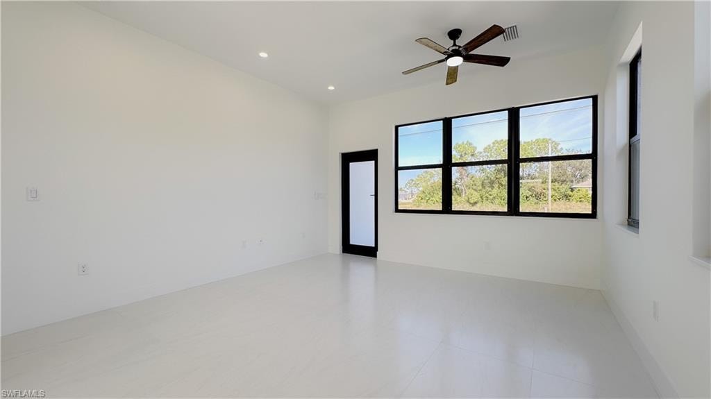 Empty room featuring recessed lighting and ceiling fan