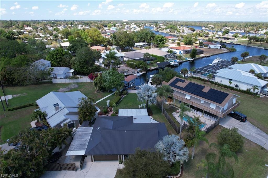 Aerial perspective of suburban area featuring a large body of water