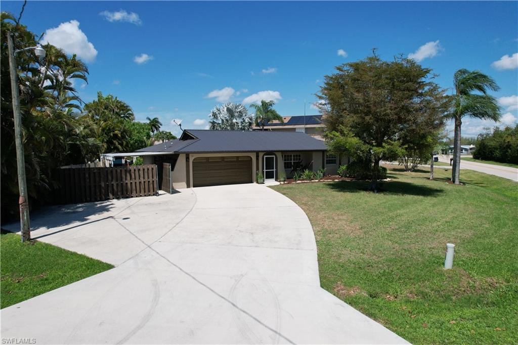 Ranch-style home with an attached garage and concrete driveway