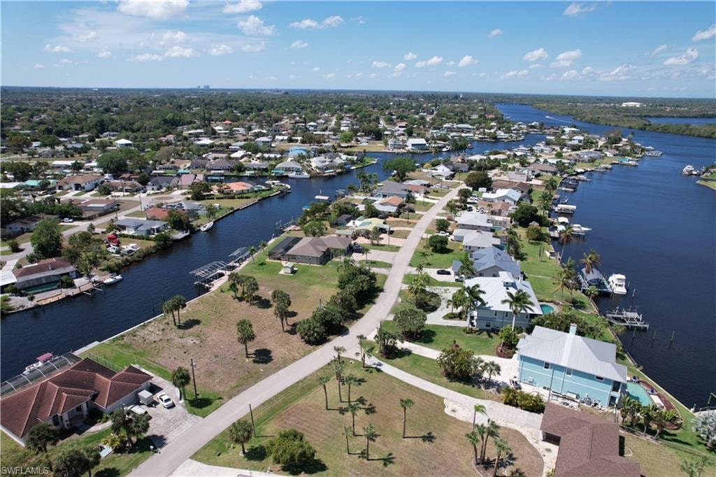 Aerial perspective of suburban area with a large body of water