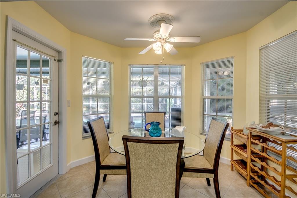 Tiled dining area with ceiling fan