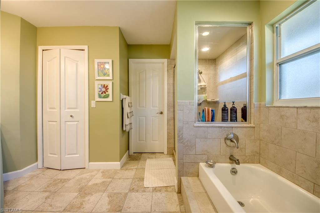Bathroom featuring plus walk in shower