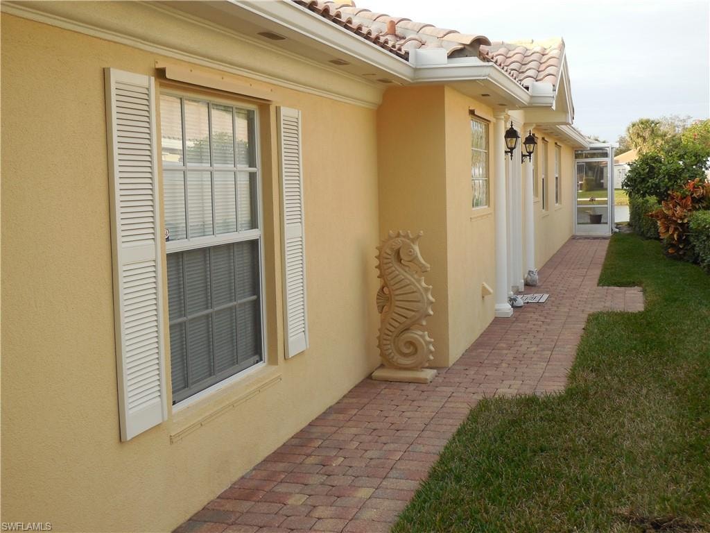 View of side of home with a patio area