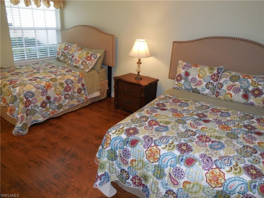 Bedroom featuring dark hardwood / wood-style flooring