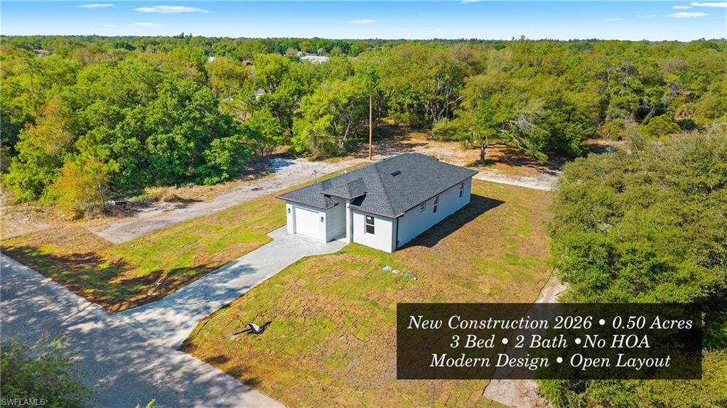 View from above of property with a heavily wooded area