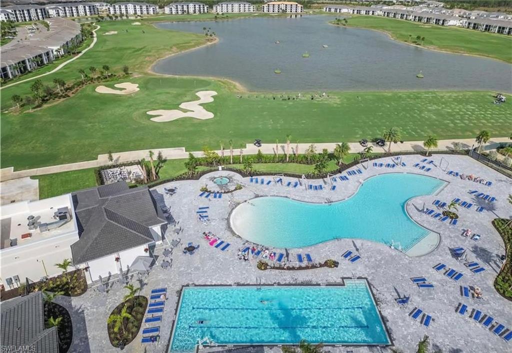 Drone / aerial view with view of golf course and a water view