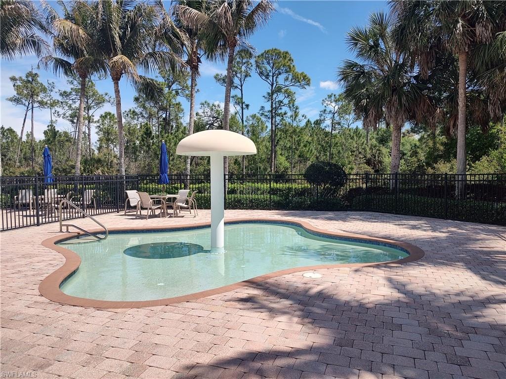 View of swimming pool featuring patio surround