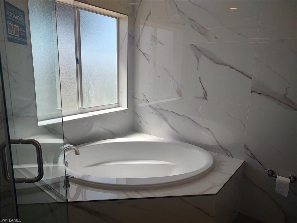 Full bath featuring a garden tub for a relaxing soak