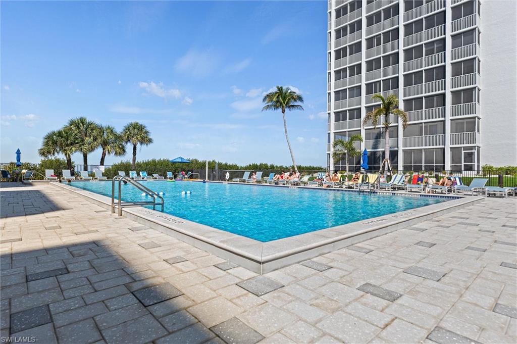 Community pool featuring a patio
