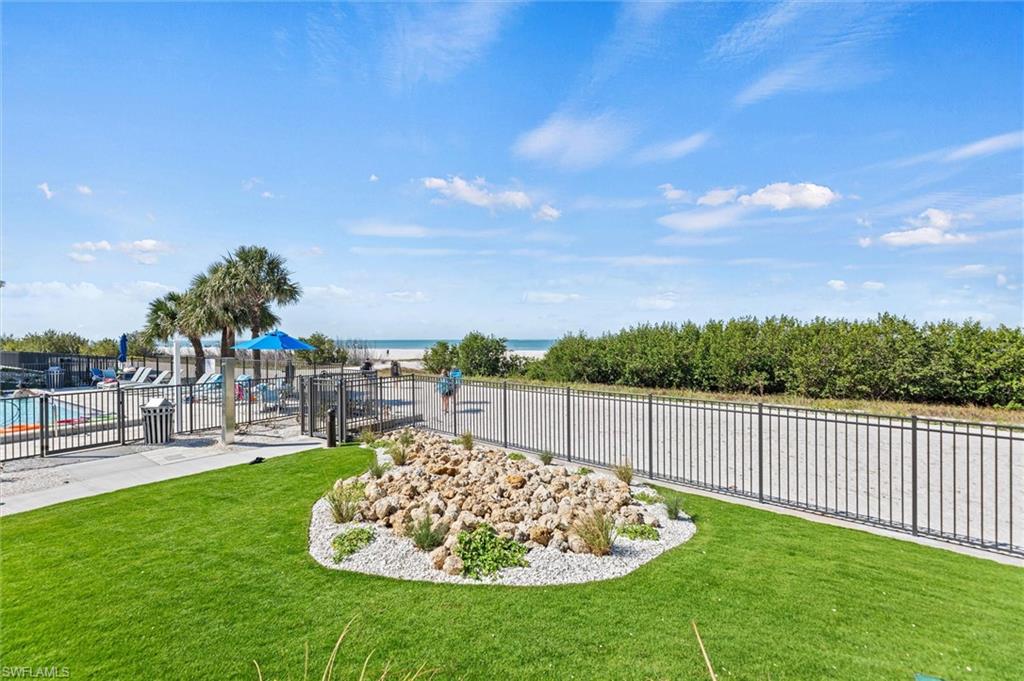 View of yard with a water view
