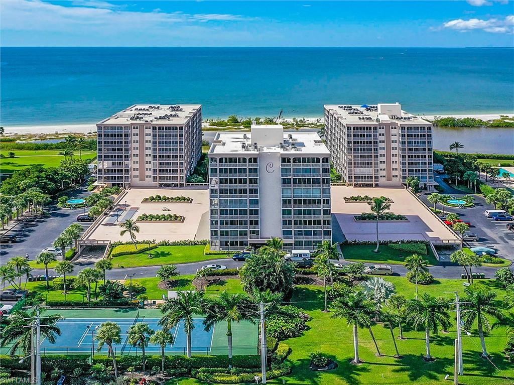 Drone / aerial view of apartment complex / building and expansive coastline
