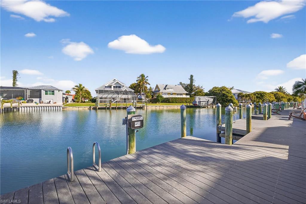 Dock featuring a water view and a residential view