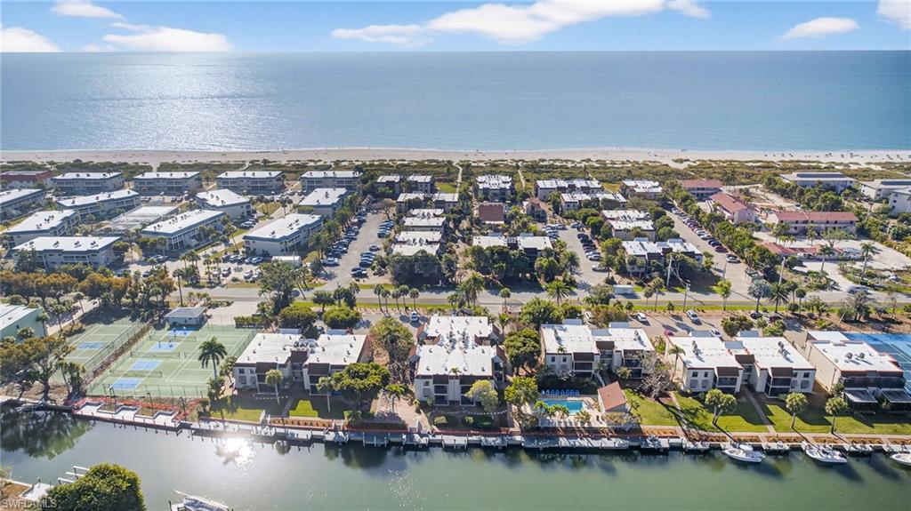 Aerial perspective of suburban area with a nearby body of water