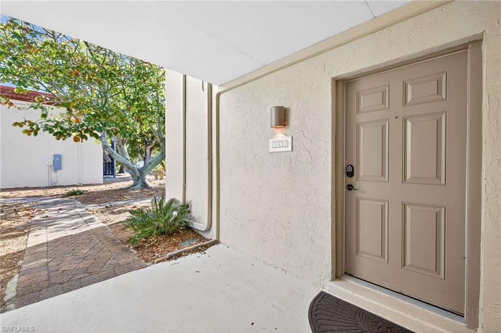 Property entrance with stucco siding