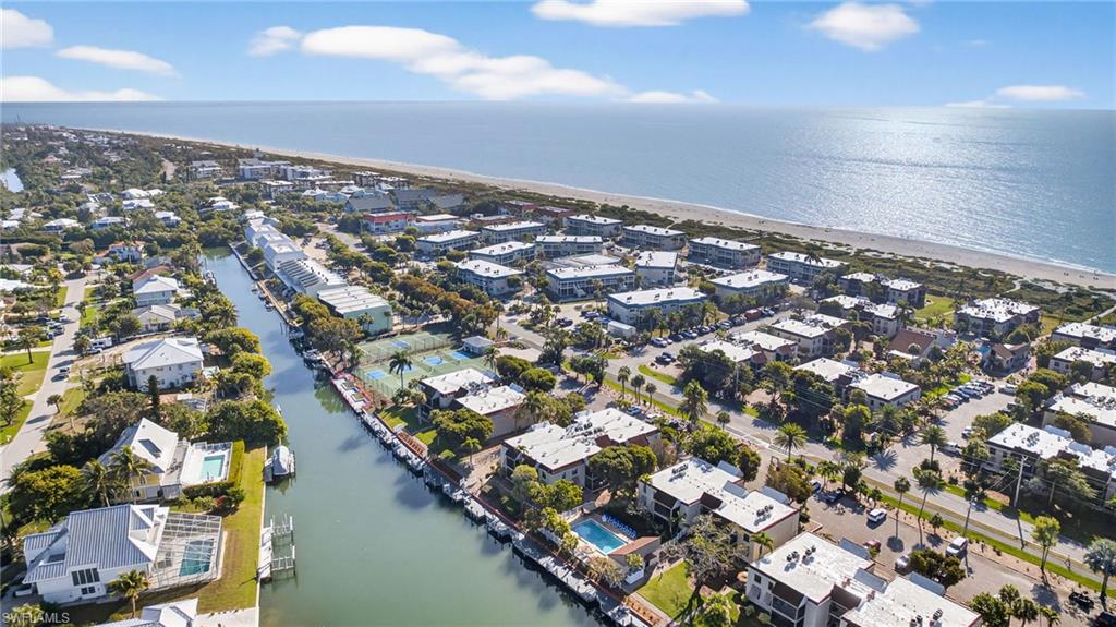 Aerial view of residential area featuring a large body of water