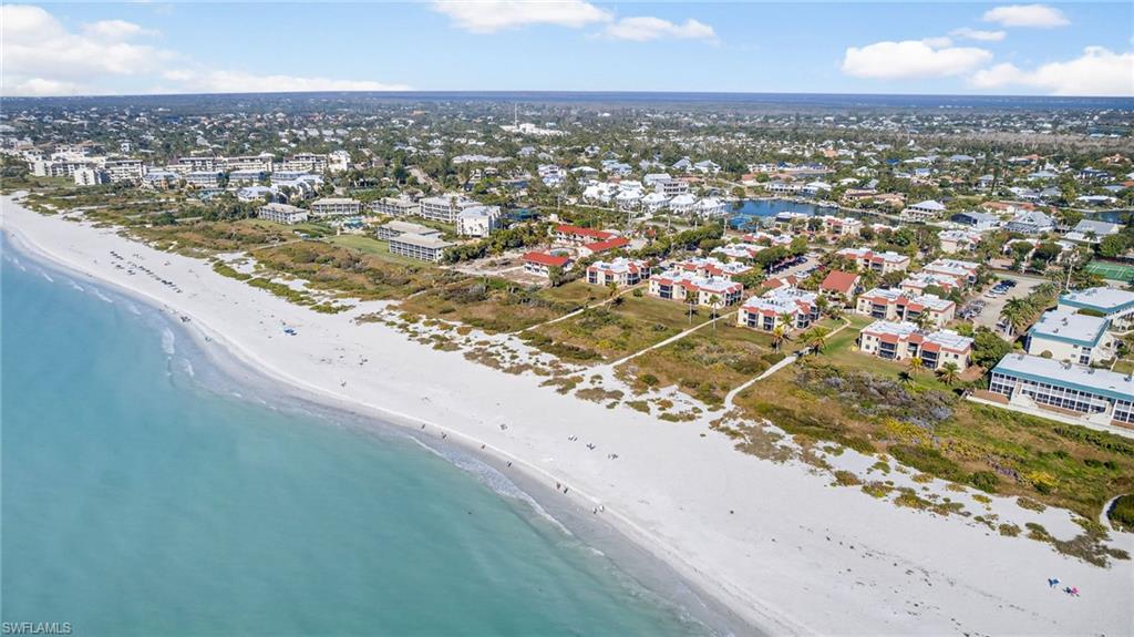 Aerial view of property's location with a nearby body of water