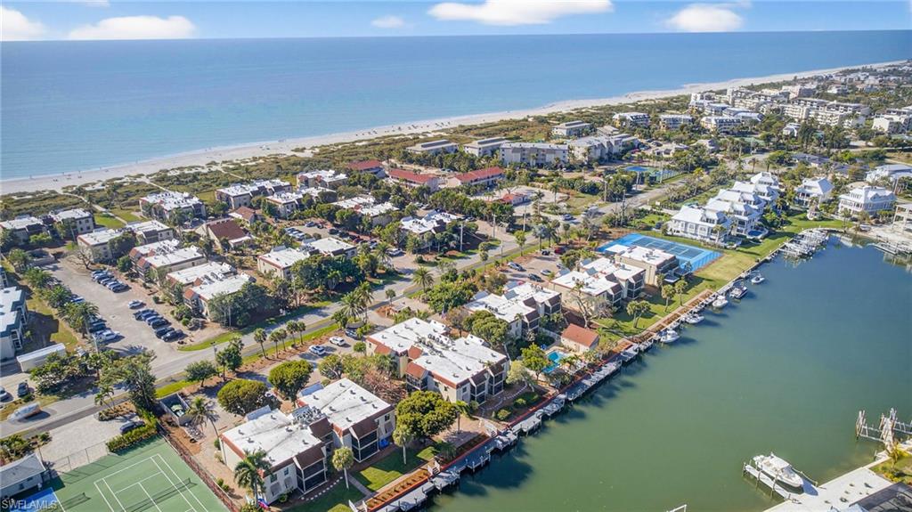 Aerial view of residential area with waterfront with a beach
