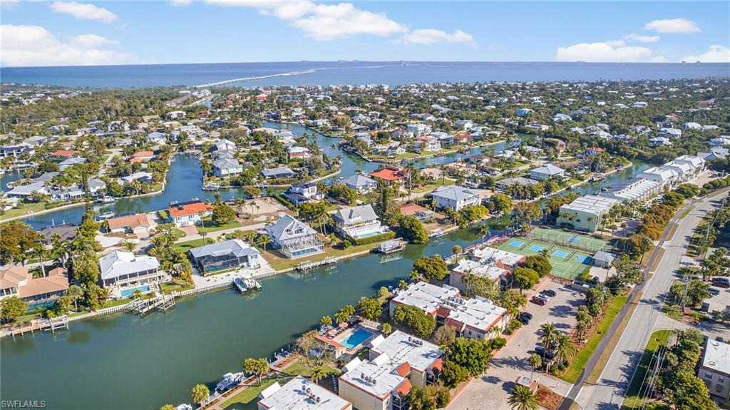 View of property location with a nearby body of water and nearby suburban area