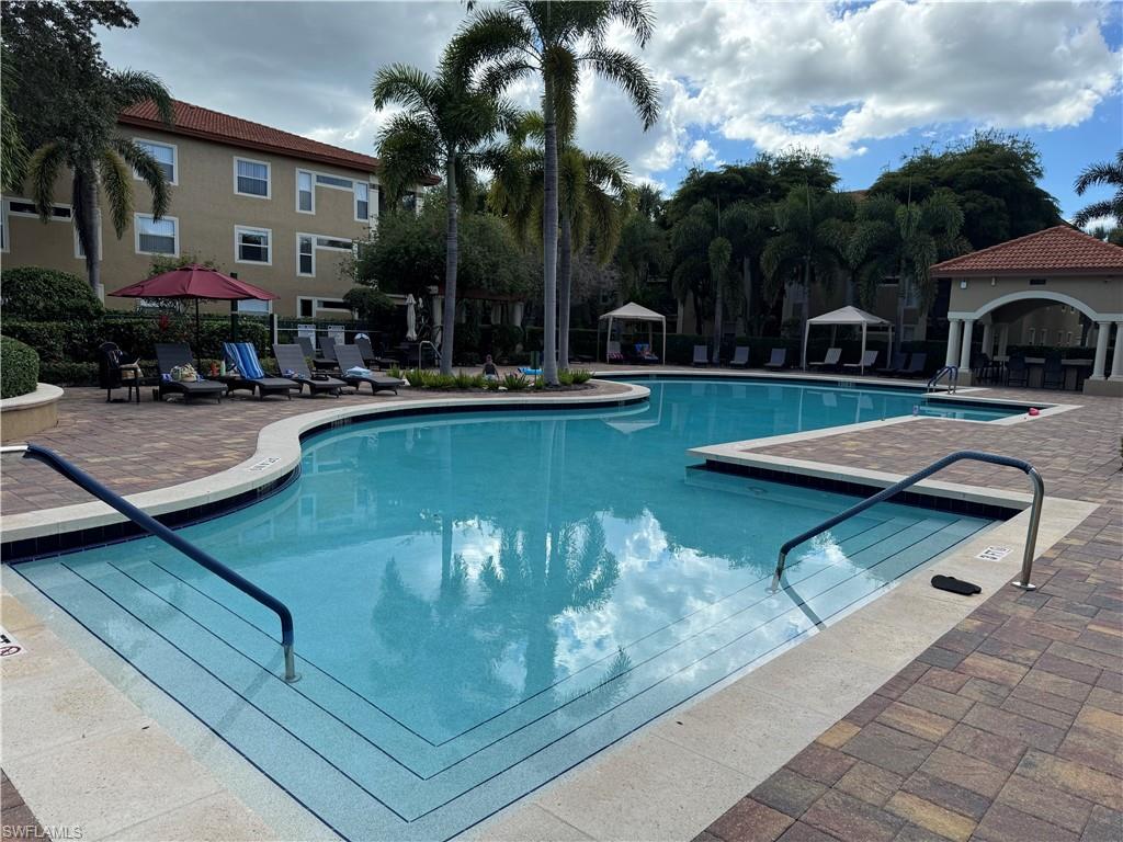 Community pool featuring a gazebo and a patio area