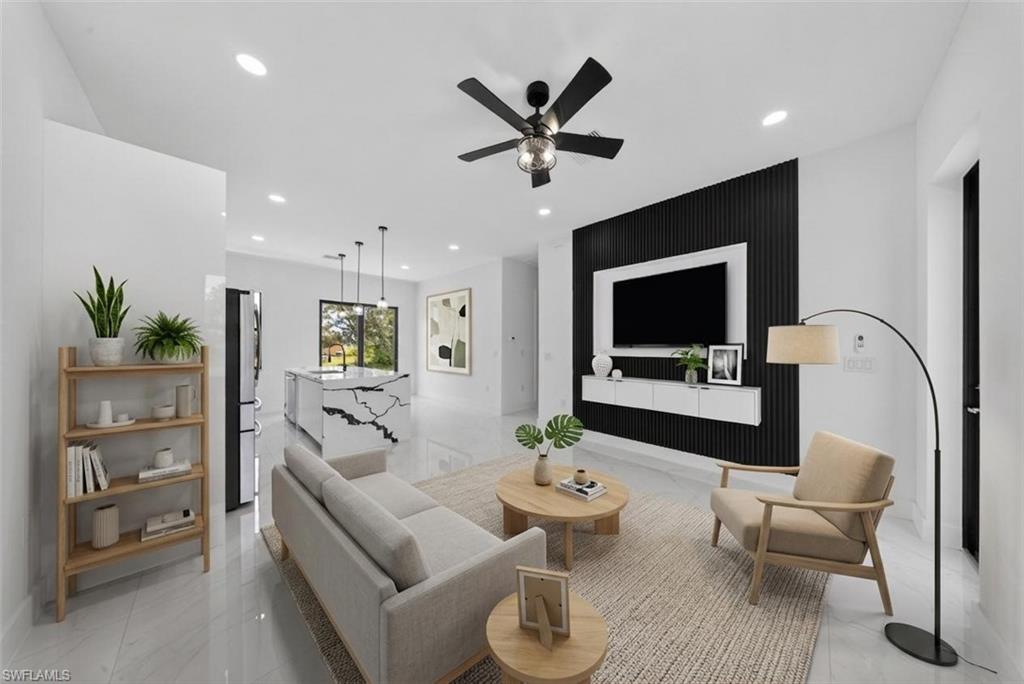 Open-concept living area with polished tile flooring, a black slatted accent wall, and recessed lighting