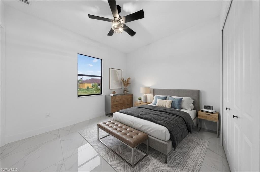 Bright interior featuring white walls and tile flooring