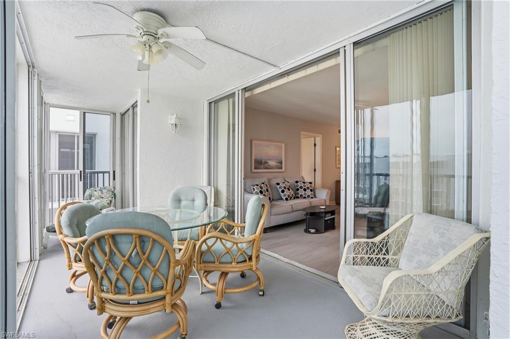 Balcony overlooks beach and pool