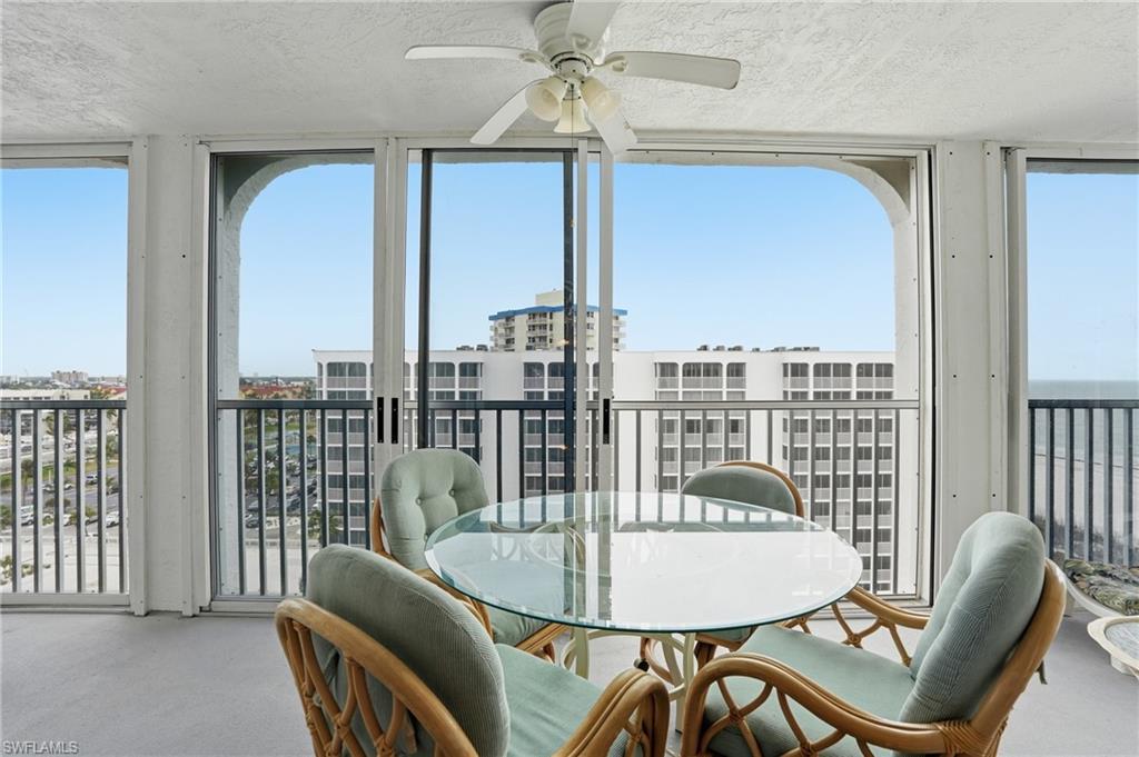Balcony overlooks beach and pool
