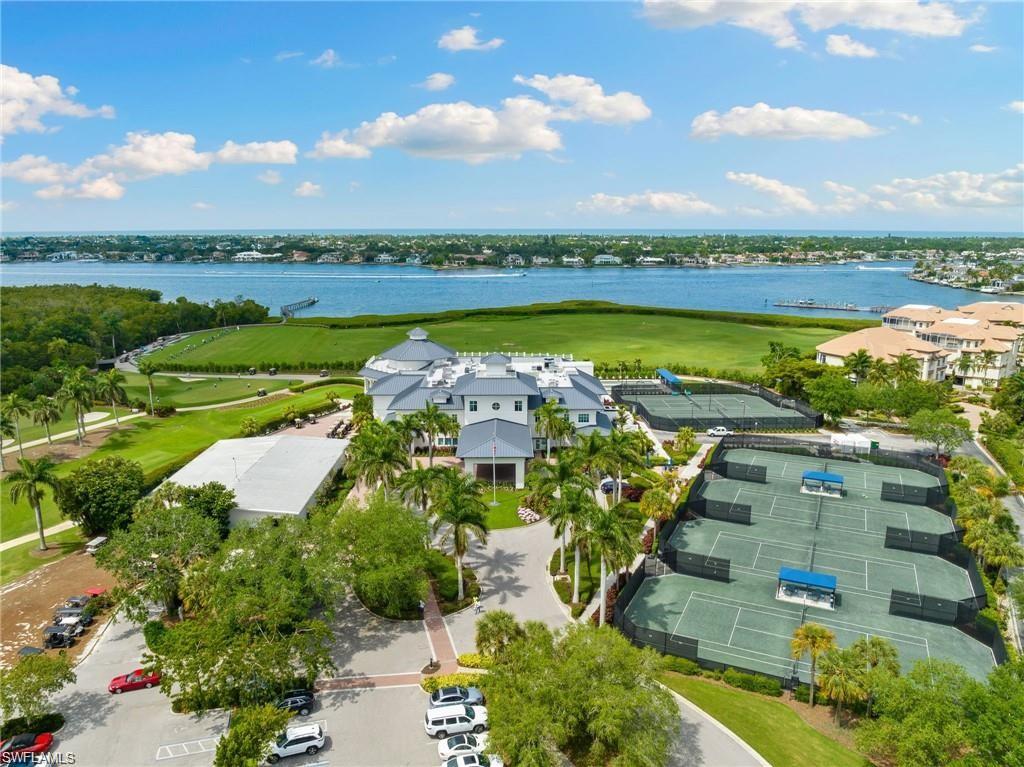 Birds eye view of property featuring a water view and view of golf course