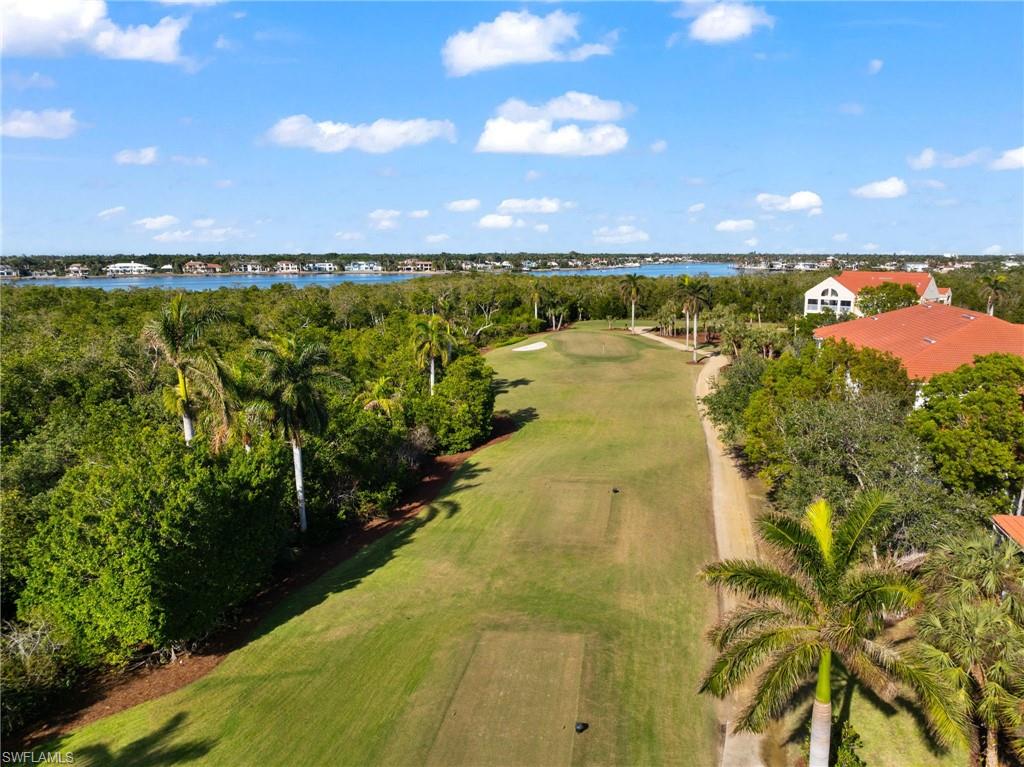 Aerial view with a water view and golf course view