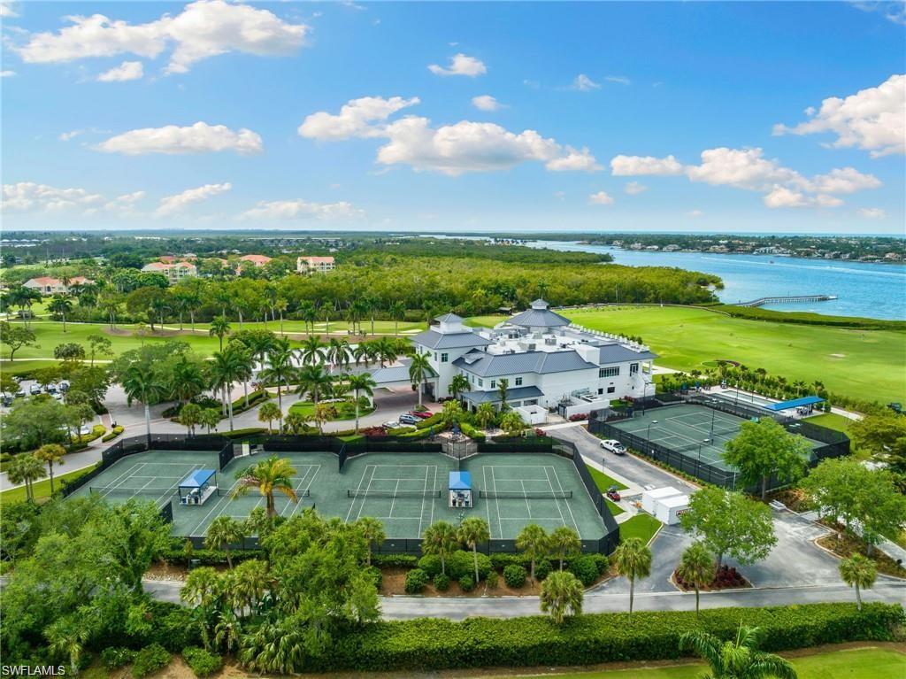 Bird's eye view with a water view and view of golf course