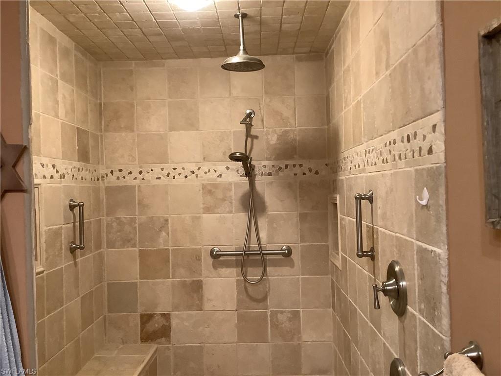 Large master walk in shower with seat