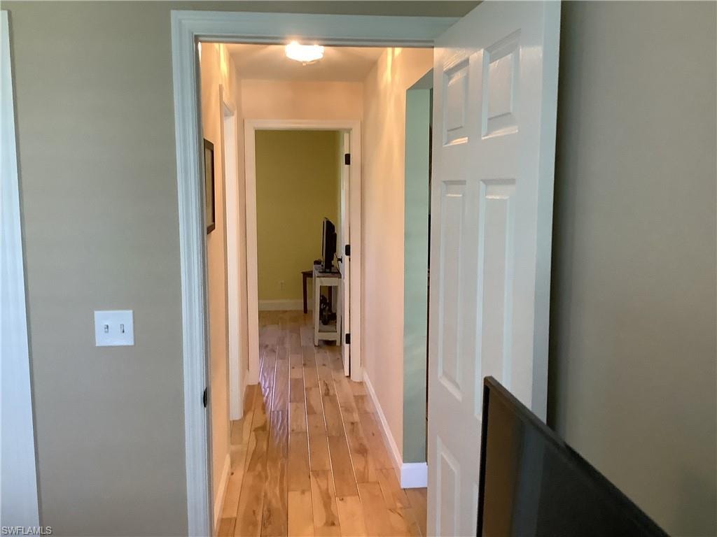 Hallway to guest bath and bedroom