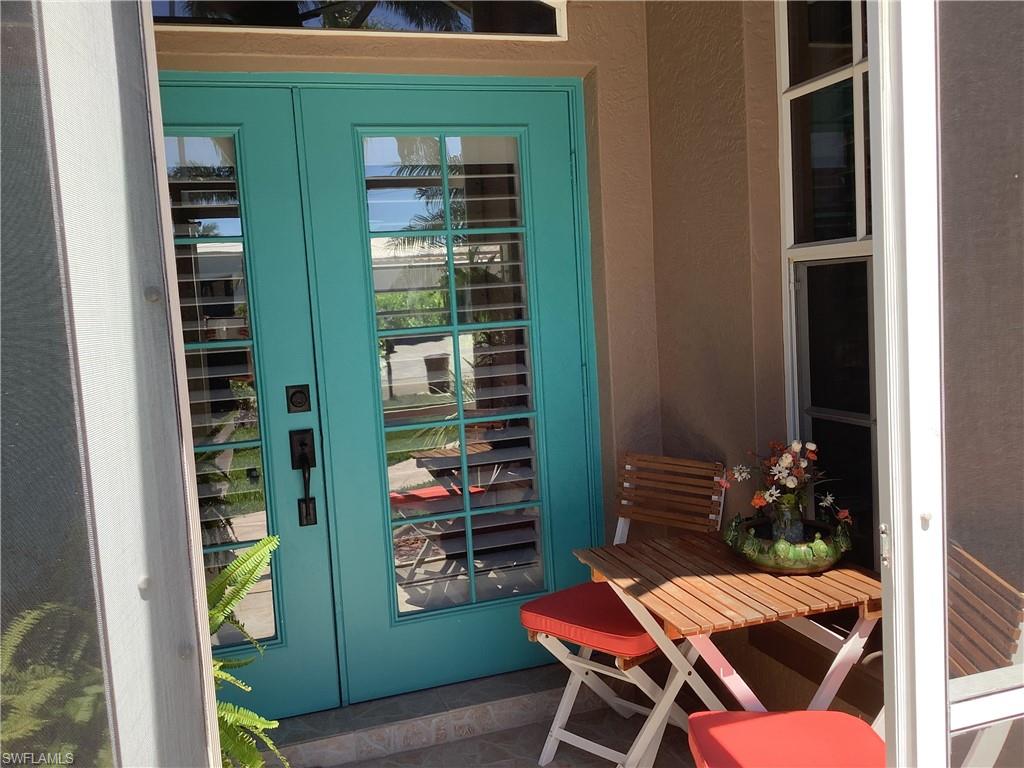 Screened front entry with electric hurricane shutter
