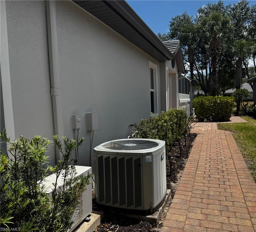 Stucco siding and a central AC unit
