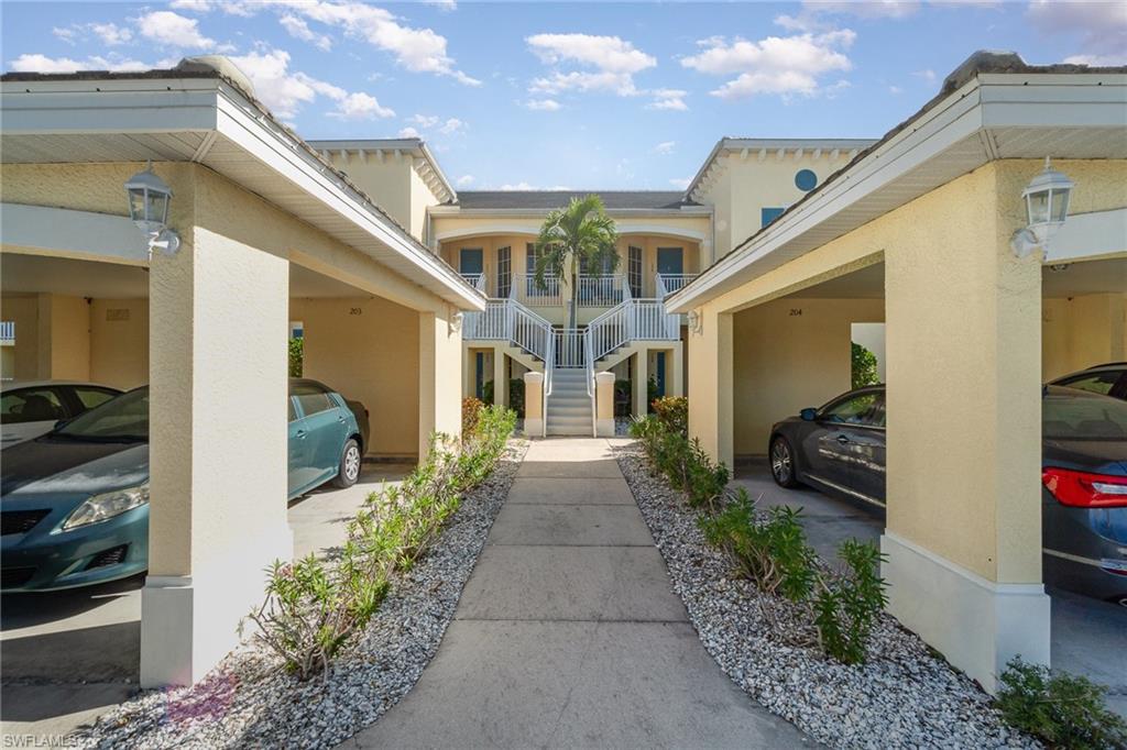 Entrance to property featuring a carport